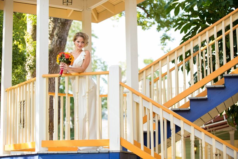 Bride looking down on camera from stairs in Orlando Florida