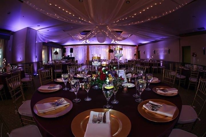 Reception hall at Falcon's Fire lit with uplights